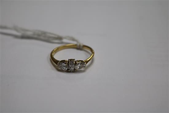 An 18ct gold and three stone diamond ring, set with pear and marquise cut stones, size K.